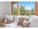 Living room view showcasing the neighborhood through a large picture window with warm wood trim at 270 31St St, Boulder, CO 80305
