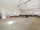 Large garage and workspace with ample room for parking vehicles and storing equipment at 61800 E 32Nd Ct, Strasburg, CO 80136