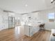 Modern kitchen with white cabinets, stainless appliances, and large island perfect for entertaining at 61800 E 32Nd Ct, Strasburg, CO 80136