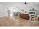 Bright living room featuring an electric fireplace and an open-concept design at 61800 E 32Nd Ct, Strasburg, CO 80136