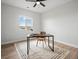Home office with a modern desk, comfortable chair, and great natural light from the window at 61800 E 32Nd Ct, Strasburg, CO 80136