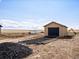 Backyard shed and outbuilding for storing tools and equipment at 61800 E 32Nd Ct, Strasburg, CO 80136