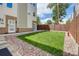 Charming backyard with green grass and brown privacy fence at 2724 Federal Blvd # 2, Denver, CO 80211