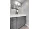 Modern bathroom with gray vanity, white countertop and large mirror at 2724 Federal Blvd # 2, Denver, CO 80211