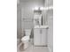 Beautiful bathroom with tiled shower, white vanity, modern lighting and fixtures at 2724 Federal Blvd # 2, Denver, CO 80211