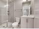 Modern bathroom with glass shower, gray walls, white vanity and new toilet at 2724 Federal Blvd # 2, Denver, CO 80211