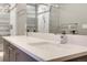 Elegant bathroom featuring double vanity sinks, sleek fixtures and a large mirror to brighten the space at 2724 Federal Blvd # 2, Denver, CO 80211