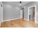 Bedroom featuring hardwood floors, neutral walls and an attached bathroom at 2724 Federal Blvd # 2, Denver, CO 80211
