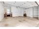 Garage featuring concrete floor, a window, built-in shelving, and work space at 2724 Federal Blvd # 2, Denver, CO 80211