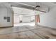 Spacious three car garage with white walls, concrete floors and automatic door at 2724 Federal Blvd # 2, Denver, CO 80211