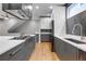 Kitchen area has modern cabinets, stainless appliances and is open to dining area at 2724 Federal Blvd # 2, Denver, CO 80211