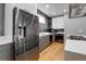 Sleek kitchen featuring stainless steel appliances, and gray and white cabinetry at 2724 Federal Blvd # 2, Denver, CO 80211