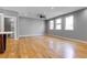 Open living room with hardwood floors, gray walls, ceiling fan and recessed lighting at 2724 Federal Blvd # 2, Denver, CO 80211