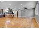 Spacious open-concept living area featuring modern decor and hardwood floors at 2724 Federal Blvd # 2, Denver, CO 80211