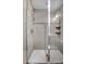 Contemporary shower featuring gray tile walls, white base and frameless glass door at 2724 Federal Blvd # 2, Denver, CO 80211