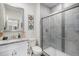Modern bathroom with a glass enclosed shower, vanity with a sink, and modern fixtures at 8815 S Tibet Ct, Aurora, CO 80016