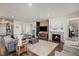 Bright and spacious living area featuring modern decor, fireplace, and stylish furnishings at 8815 S Tibet Ct, Aurora, CO 80016