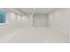 Finished basement with neutral carpeting and recessed lighting at 2468 S Cherokee St, Denver, CO 80223