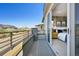 Private balcony accessible from the main bedroom, offering neighborhood views and outdoor living space at 9006 E 60Th Ave, Denver, CO 80238