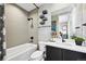 Contemporary bathroom with stylish vanity, modern fixtures, and tiled shower at 9006 E 60Th Ave, Denver, CO 80238