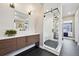 Stylish bathroom with modern vanity, glass-enclosed shower, and contemporary design elements at 9006 E 60Th Ave, Denver, CO 80238
