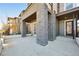 Home exterior with stone pillars supporting a covered porch and a view of house number 9006 at 9006 E 60Th Ave, Denver, CO 80238