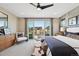 Cozy main bedroom features a private balcony, stylish furnishings, and lots of natural light at 9006 E 60Th Ave, Denver, CO 80238