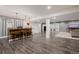 Finished basement with bar, seating, and entertainment area, perfect for gatherings at 15205 W Iliff Ave, Lakewood, CO 80228