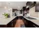 Bright, modern kitchen with stainless appliances and ample counter space at 15205 W Iliff Ave, Lakewood, CO 80228