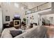 Bright and airy living room with a fireplace, tall ceilings, and modern finishes at 15205 W Iliff Ave, Lakewood, CO 80228