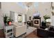 Bright and airy living room with high ceilings, fireplace, and comfortable seating at 15205 W Iliff Ave, Lakewood, CO 80228