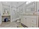 Bright bathroom with a tiled shower, a vanity and modern fixtures at 13 Pinyon Pine Rd, Littleton, CO 80127