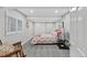 Well-lit bedroom with a cozy bed and stylish side tables, offering a comfortable and inviting space at 13 Pinyon Pine Rd, Littleton, CO 80127