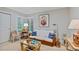 Comfortable bonus room with ample seating and natural light from shuttered windows at 13 Pinyon Pine Rd, Littleton, CO 80127