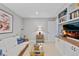 A comfortable living room with built-in shelves, TV, and a cozy white couch with blue and white pillows at 13 Pinyon Pine Rd, Littleton, CO 80127