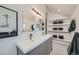 Stylish bathroom featuring dual sinks, modern fixtures, and open shelving, creating a functional and attractive space at 5127 Lowell Blvd, Denver, CO 80221