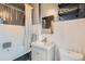 Charming bathroom with classic fixtures, including a vintage-style bathtub and a modern vanity, blending old and new at 5127 Lowell Blvd, Denver, CO 80221