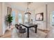 Bright dining room with a black table and gray chairs at 5127 Lowell Blvd, Denver, CO 80221
