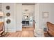 View of the dining room with gray cushioned chairs and hardwood flooring at 5127 Lowell Blvd, Denver, CO 80221