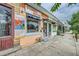 A quaint store featuring prominent signage, a vibrant exterior, and a welcoming entrance at 5127 Lowell Blvd, Denver, CO 80221