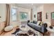 Cozy living room with hardwood floors and a comfortable sofa at 5127 Lowell Blvd, Denver, CO 80221