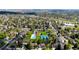 Aerial view of the community with swimming pool, tennis courts and mature tree coverage at 6918 E Easter, Centennial, CO 80112