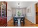 Classic dining room with hardwood floors, a dining table set for six, and natural lighting at 6918 E Easter, Centennial, CO 80112