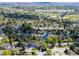 Aerial view of the neighborhood with mature trees, a greenbelt trail, and a nearby elementary school at 6918 E Easter Pl, Centennial, CO 80112