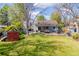 Spacious backyard with a patio dining set and barbecue, perfect for entertaining at 6918 E Easter Pl, Centennial, CO 80112