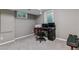 Basement home office setup with desk, computer, and comfortable chair at 6918 E Easter Pl, Centennial, CO 80112