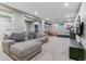 Finished basement provides a cozy lounge area with comfortable seating and ample space at 6918 E Easter Pl, Centennial, CO 80112