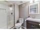 Bathroom features a glass-enclosed shower, white subway tile, and a vanity with a sink at 6918 E Easter Pl, Centennial, CO 80112