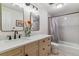 Well lit bathroom featuring single sink with quartz countertops and shower/tub combo at 6918 E Easter Pl, Centennial, CO 80112