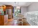 Cozy dining area adjacent to the kitchen features hardwood floors and sliding glass doors to the yard at 6918 E Easter Pl, Centennial, CO 80112